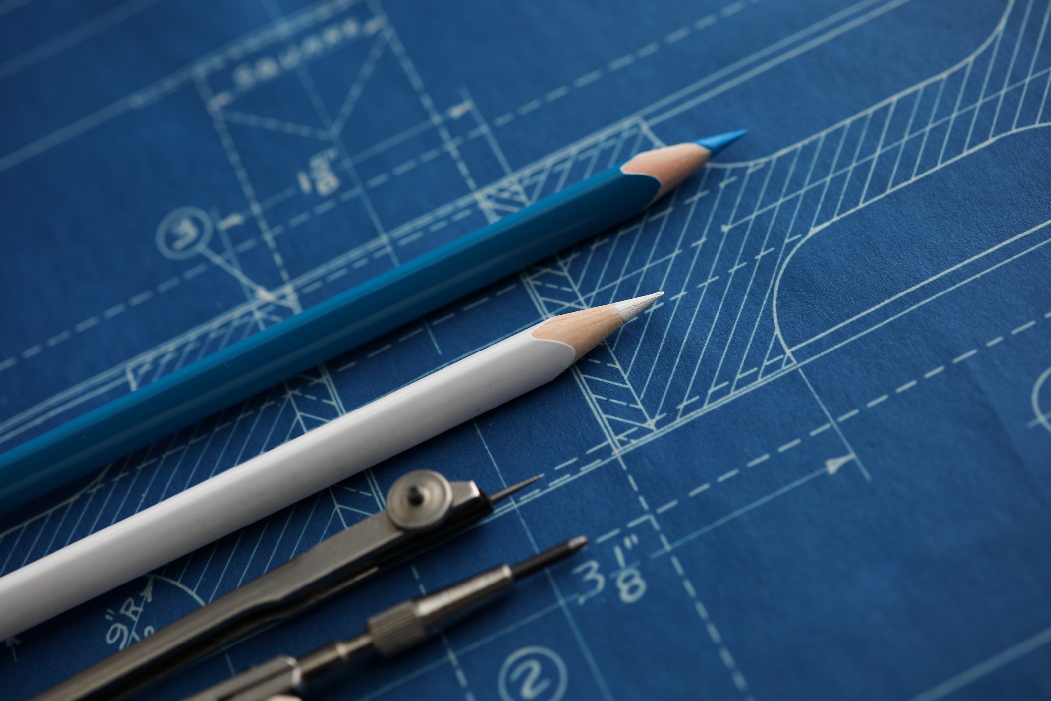 Architectural blueprints with drafting tools