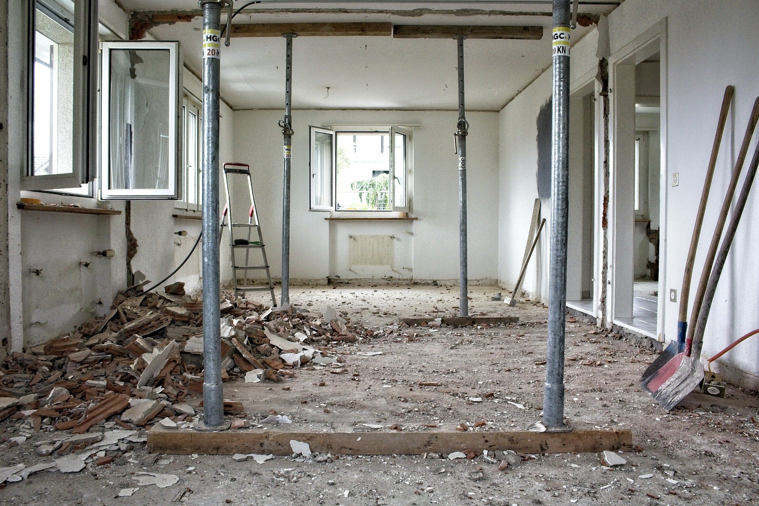 An interior undergoing major renovation with structural supports