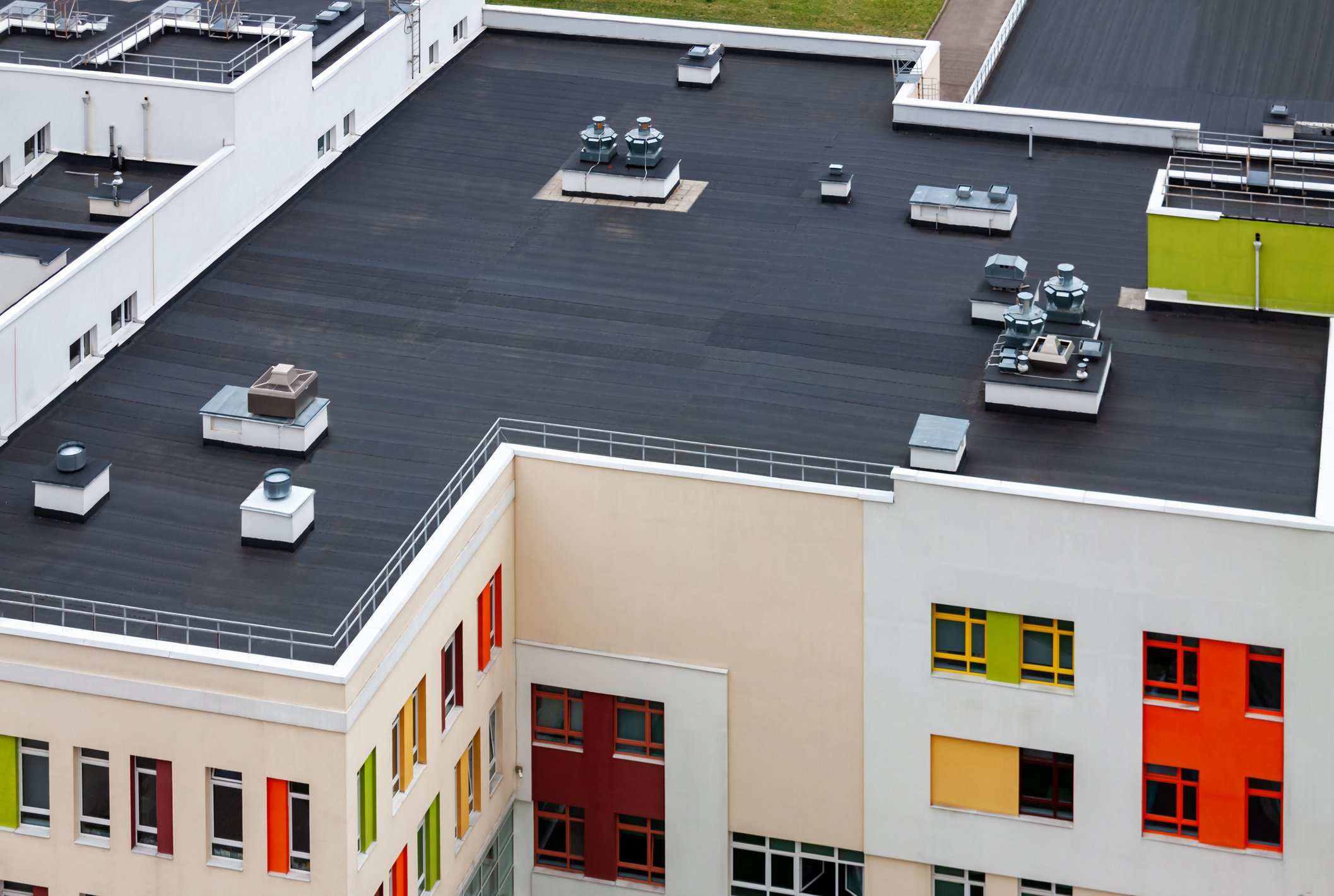 Aerial view of a modern building with a flat roof