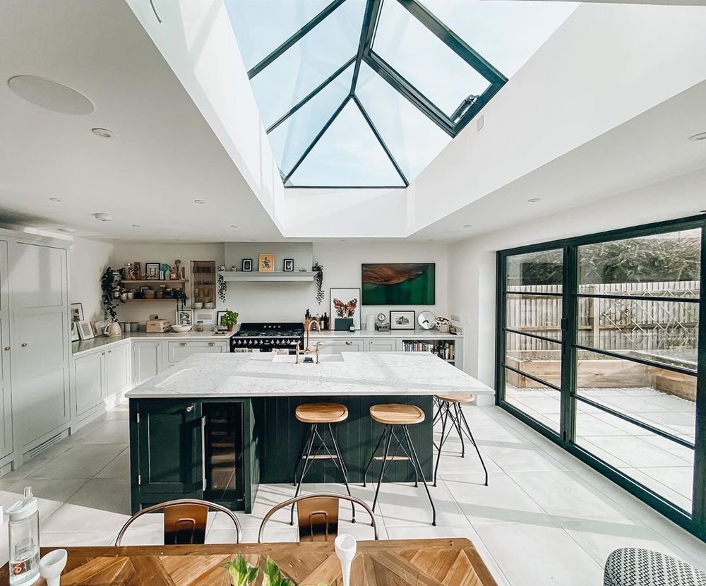 A modern kitchen extension with rooflight and Crittall-style doors
