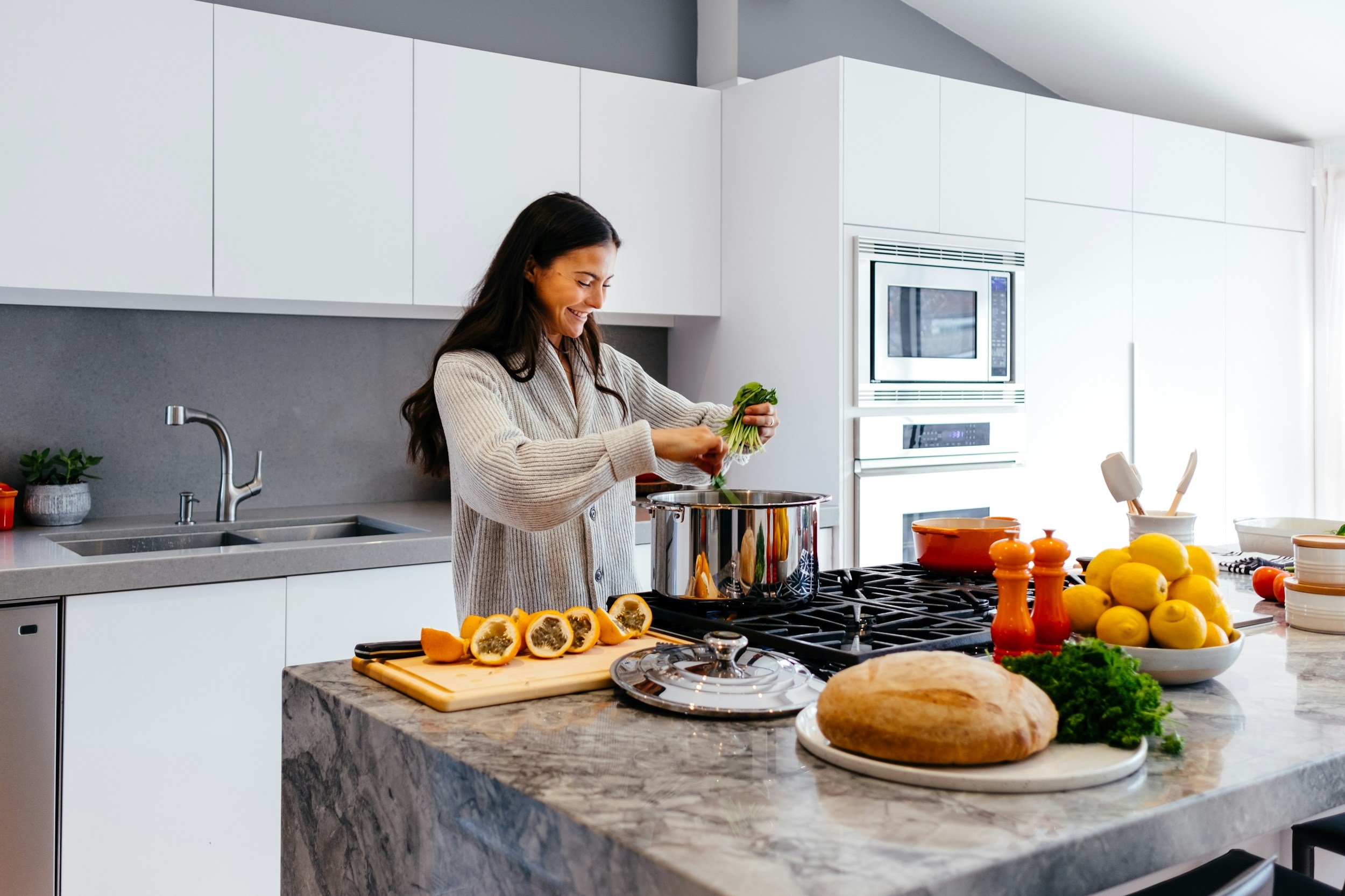 A modern kitchen interior with marble island