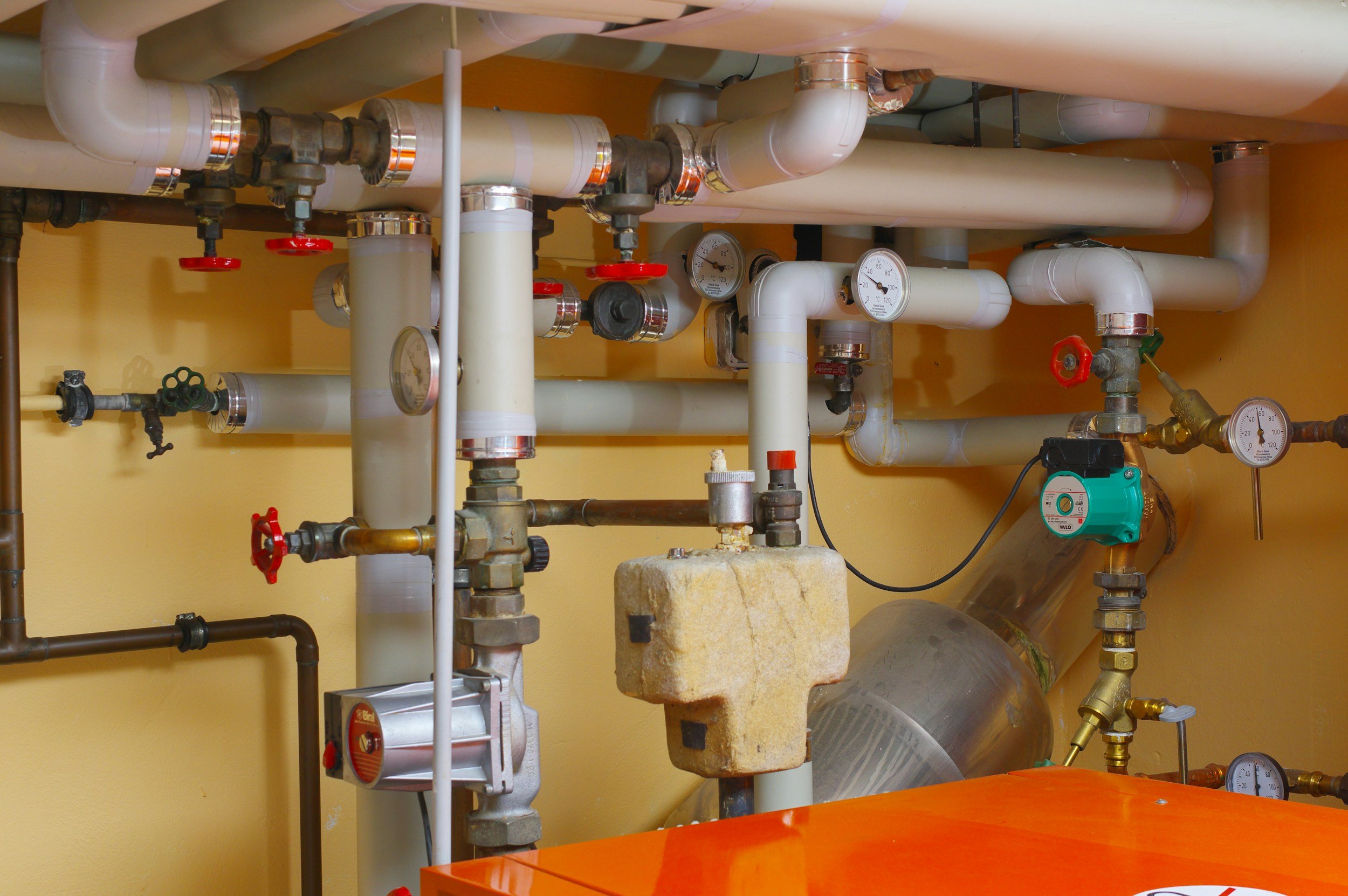 A network of hot water system pipes and gauges