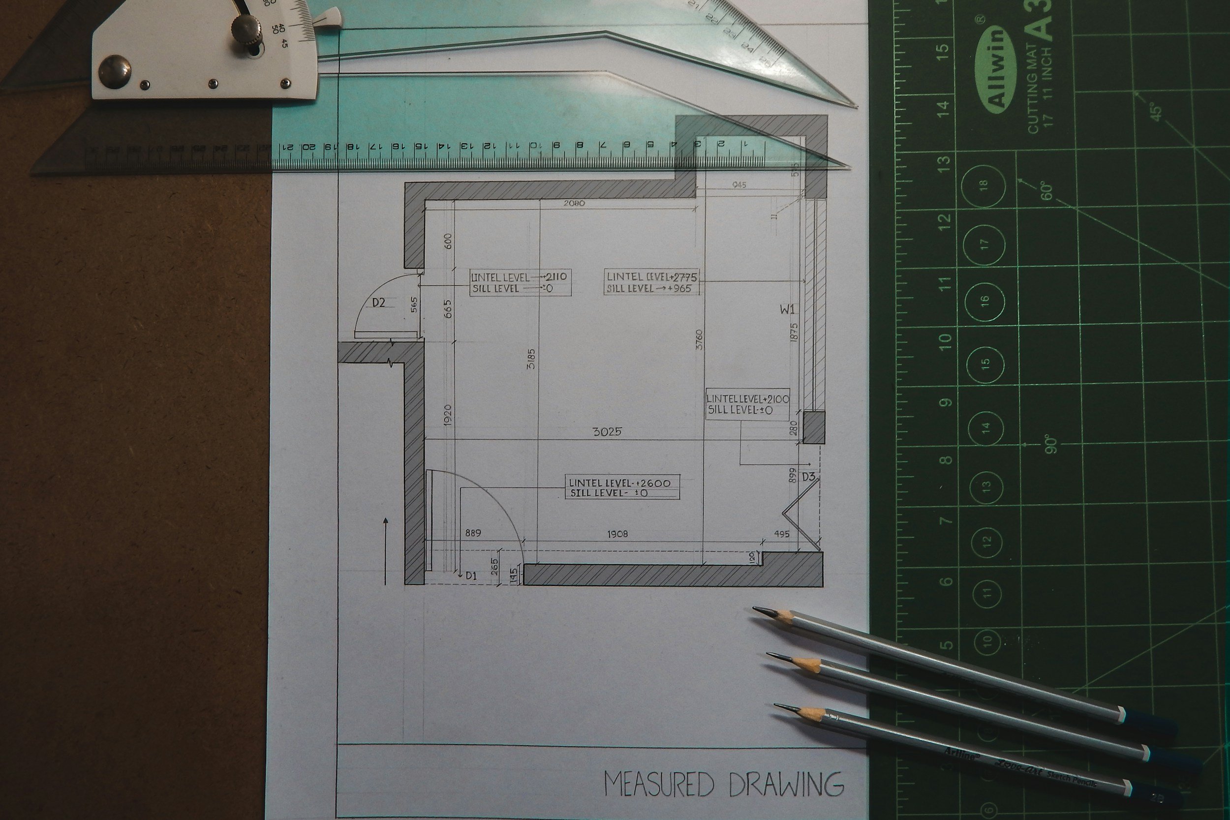 Architectural measured drawing with drafting tools