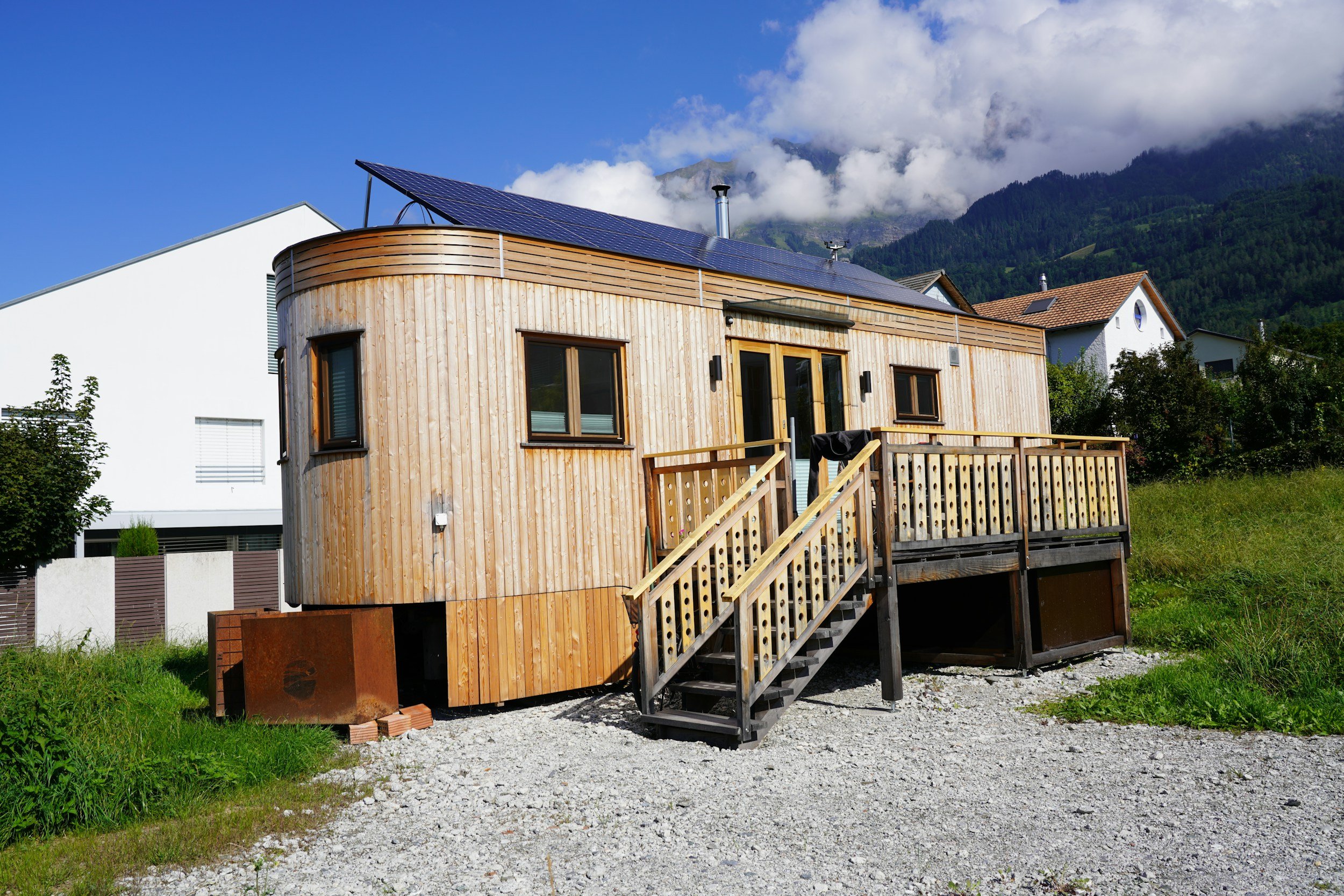 Modern wooden transportable garden room with solar panels