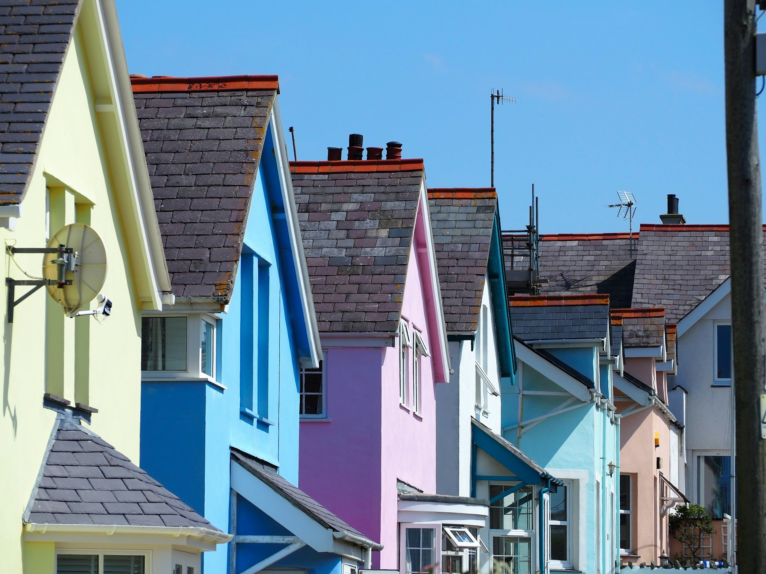 Row of colorful pitched-roof residential houses