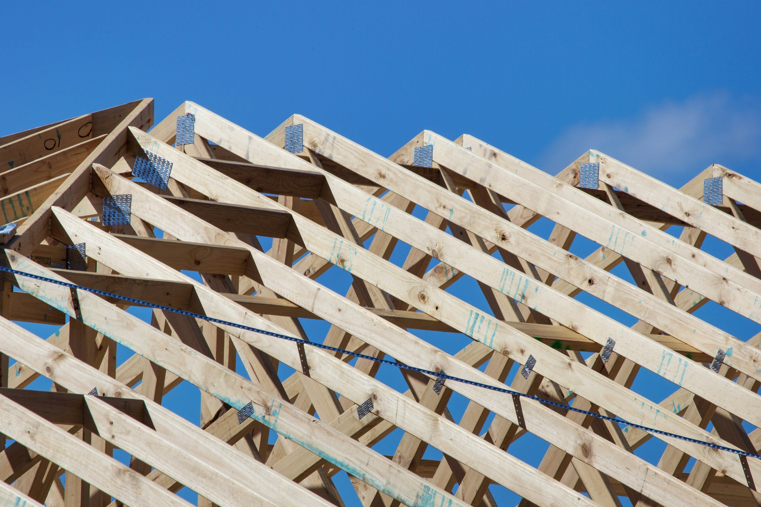 Prefabricated roof trusses under construction