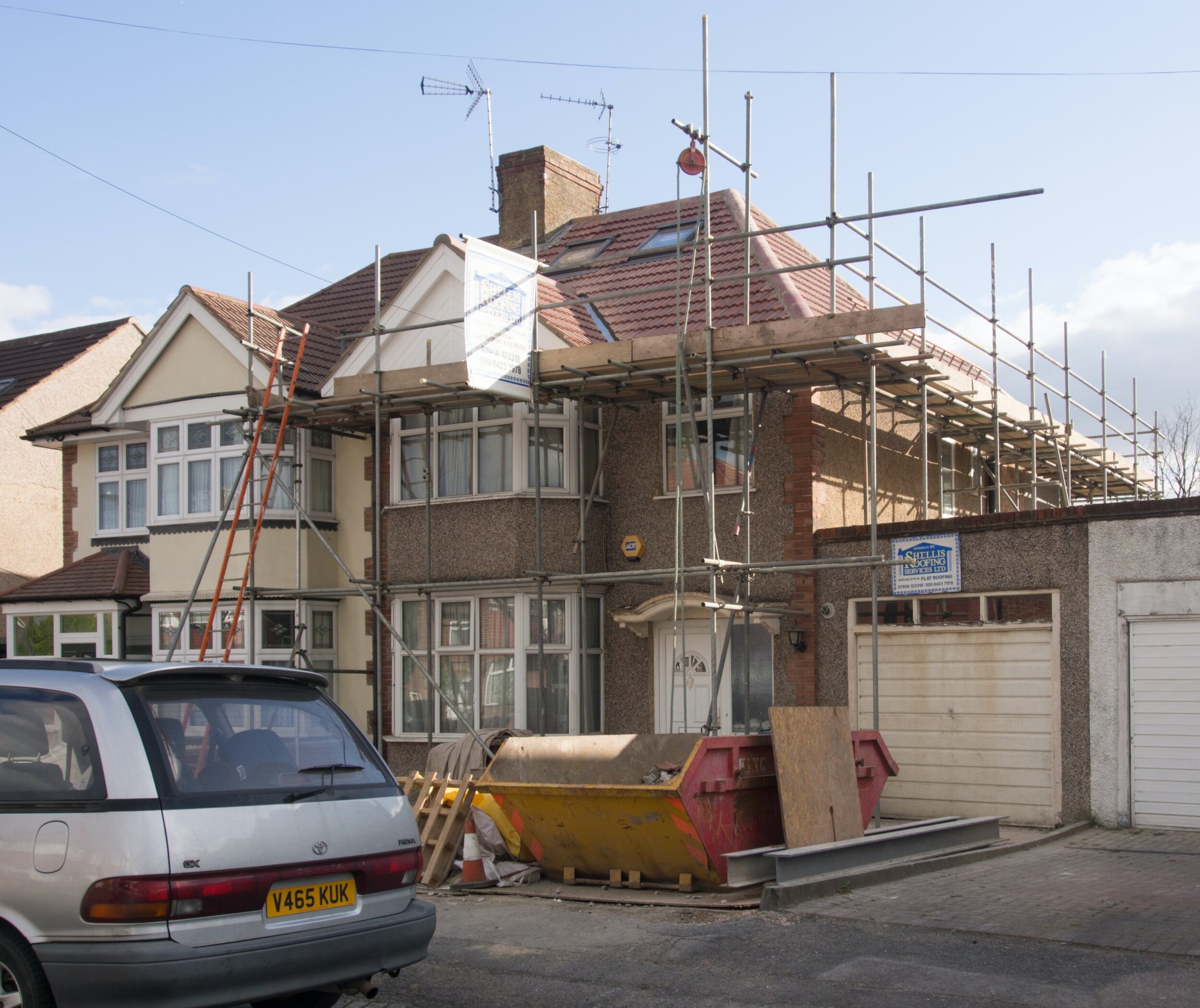 House undergoing a loft conversion with scaffolding